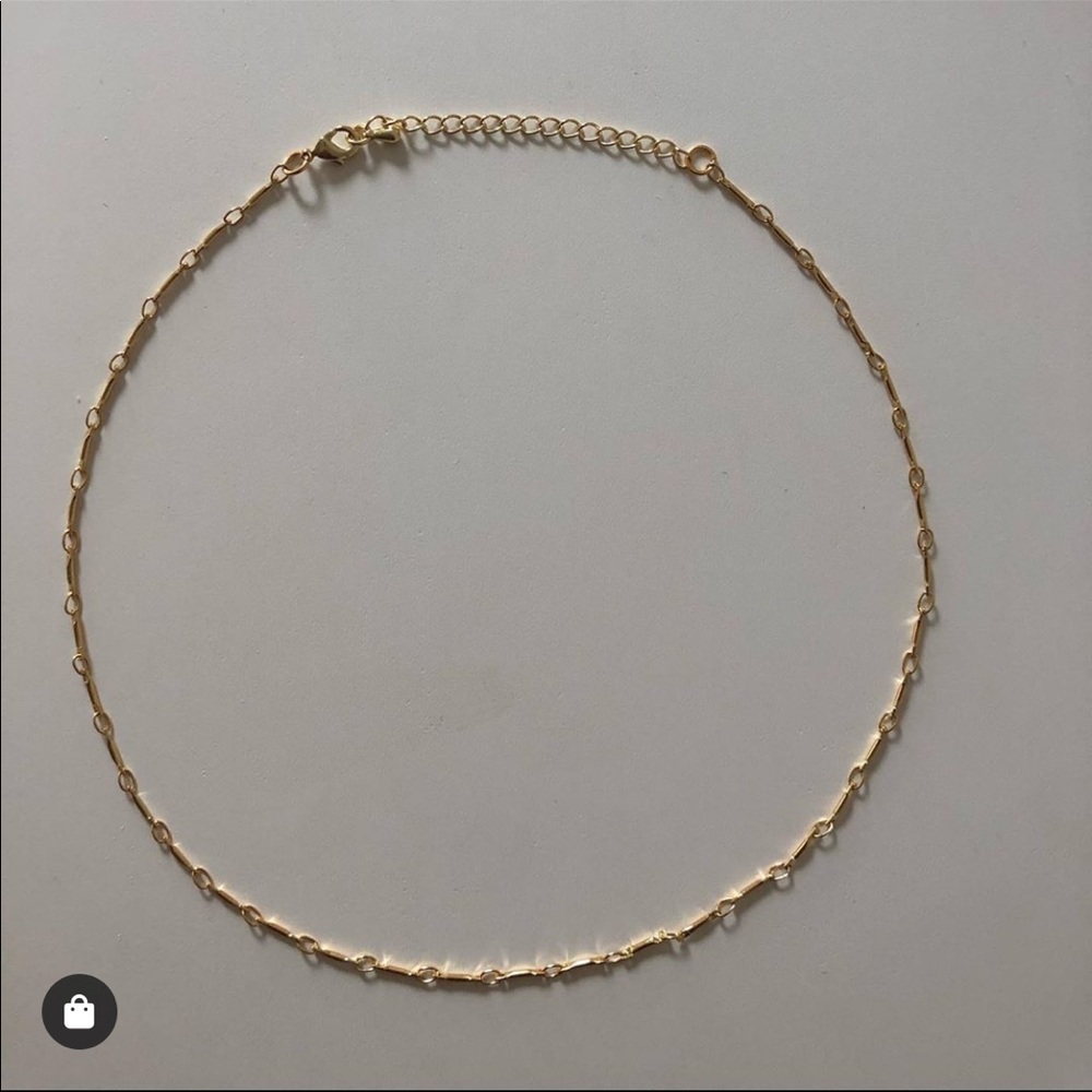 Gold link choker necklaces.